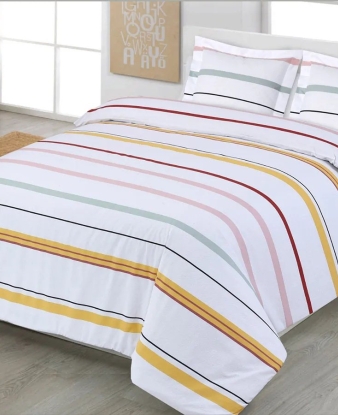 Funda Nórdica Xàbia de Dhestia Home con diseño de rayas multicolor en cama de matrimonio