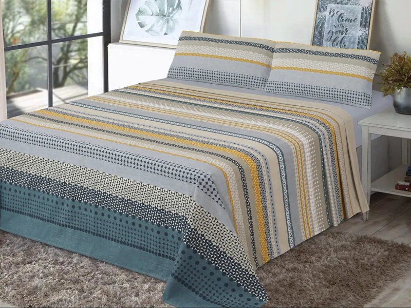 uego de Sábanas Karima Dhestia Home con diseño geométrico y tonos mostaza y azul