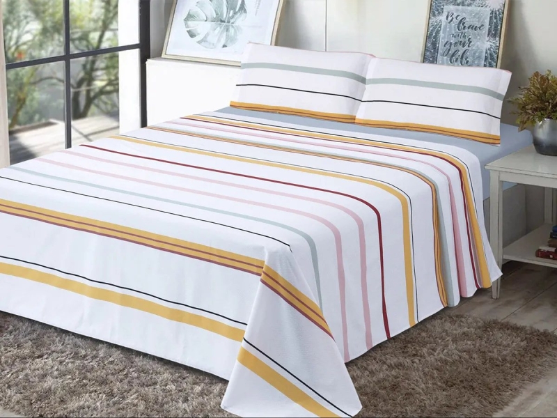 Juego de Sábanas Xàbia Dhestia Home con diseño de rayas multicolor en el dormitorio