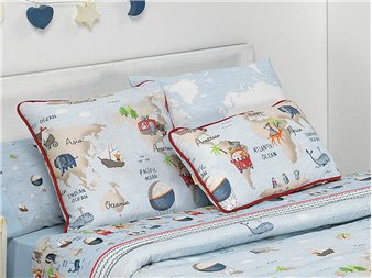 cojines mondo estampados coordinados sobre cama juvenil canete